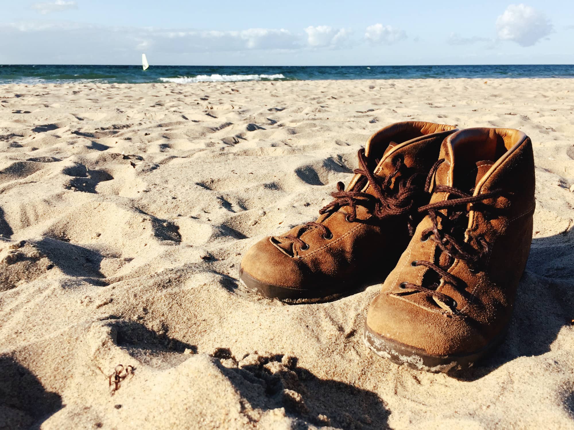Walking boots on beach