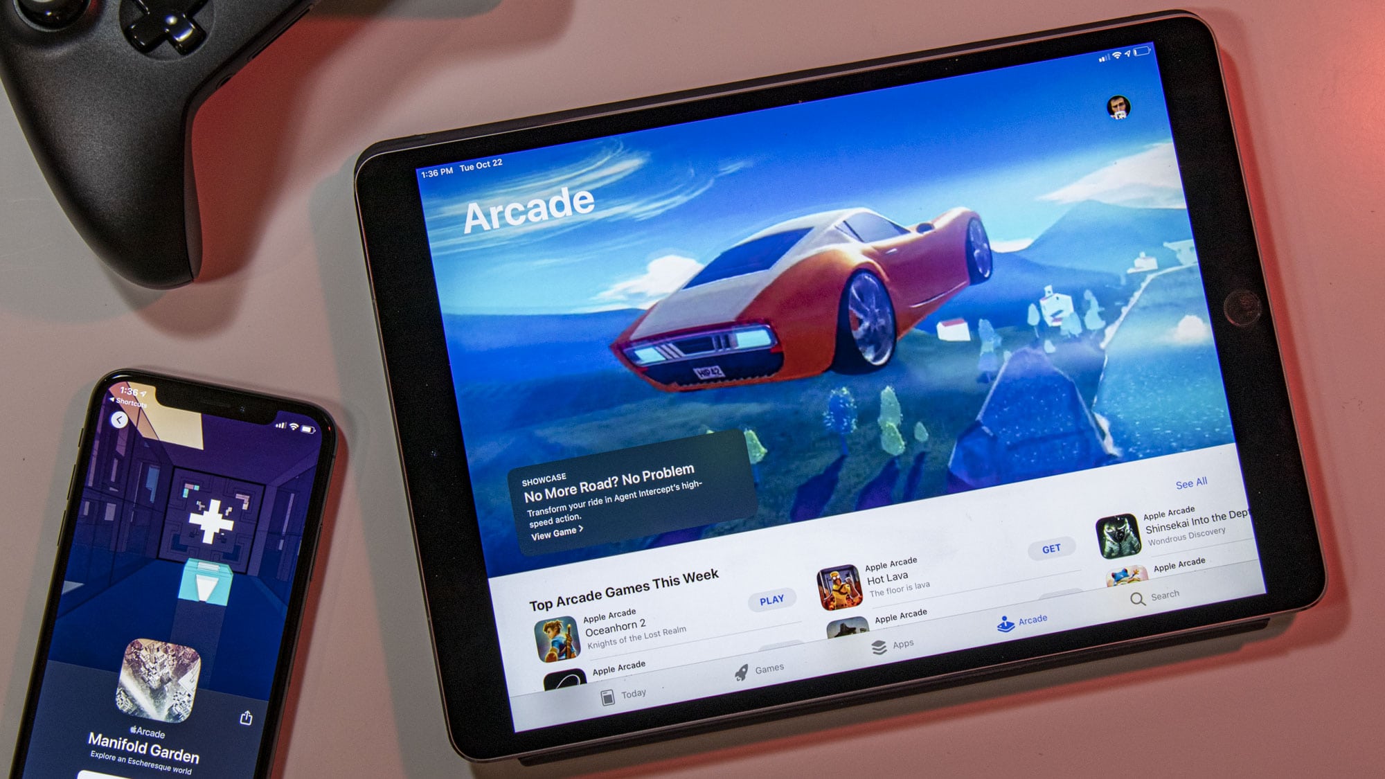 iPad browsing Apple Arcade games catalog with iPhone and Xbox Controller
