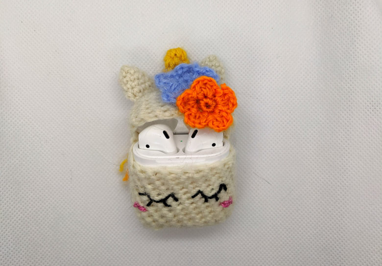 Crochet AirPods covers A musical unicorn adorns this crochet AirPods cover.