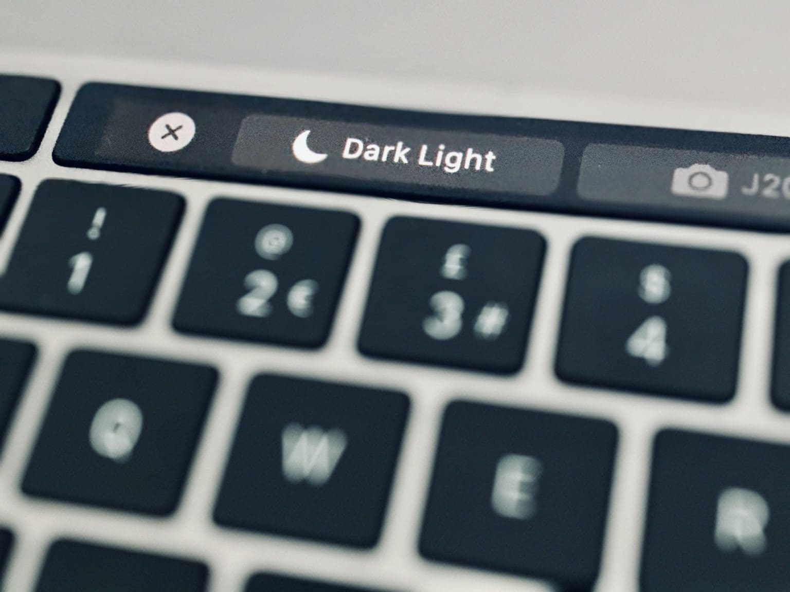 The homemade Dark Mode button lets you toggle between Dark Mode and the MacBook Pro's regular appearance, right from your Touch Bar.