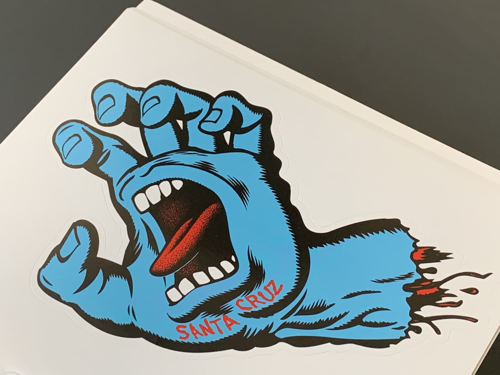 The Santa Cruz Screaming Hand is an excellent skateboard sticker for your MacBook.