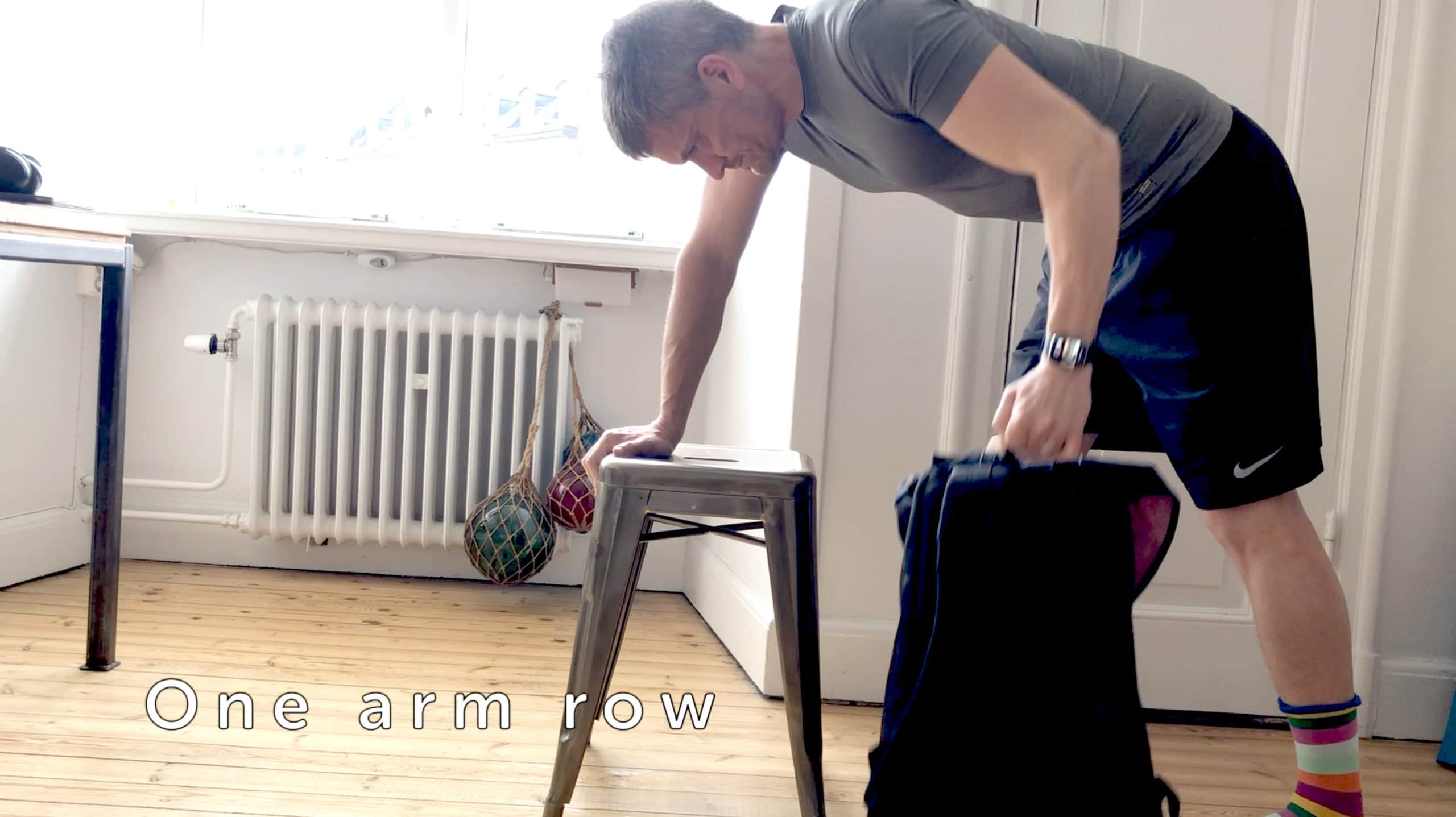 Fill a rucksack with heavy objects for an effective one-arm row.