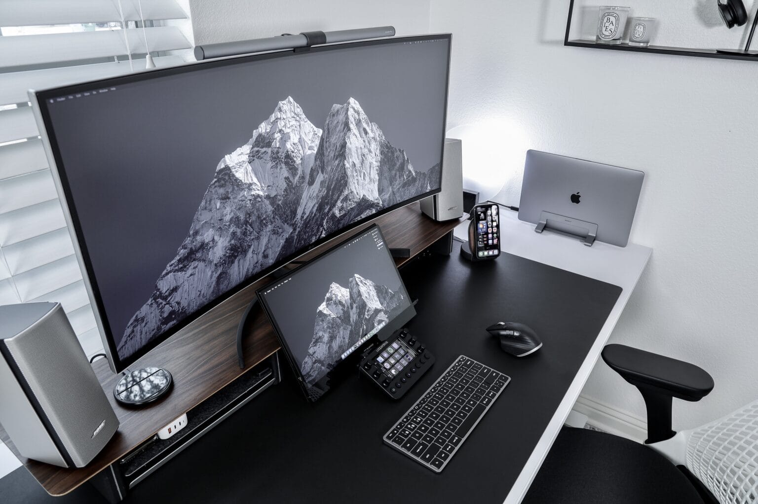 Instagram content creator Matt Tran runs his MacBook Pro with an ultrawide screen and a portable one for different reasons.