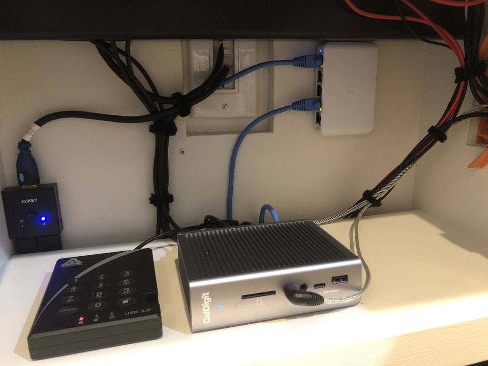 A CalDigit TS3 Dock and an encrypted 2 TB external drive are key to the setup.