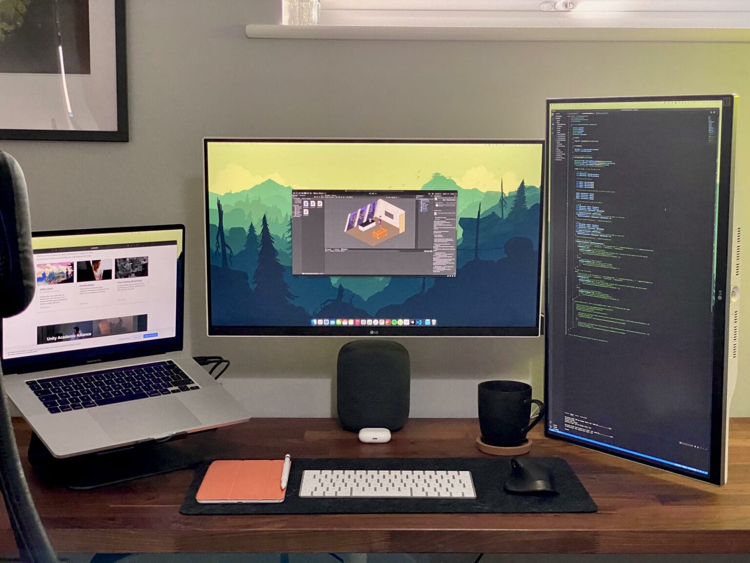A game developer makes good use of wide and tall monitors.