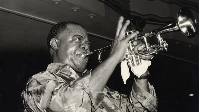 Jazz legend Louis Armstrong plays his trumpet.