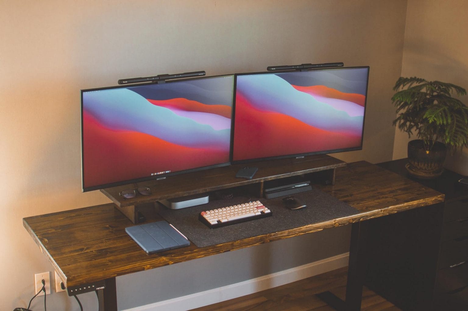 Two smart monitors with matching light bars easily run off a Mac mini M1.