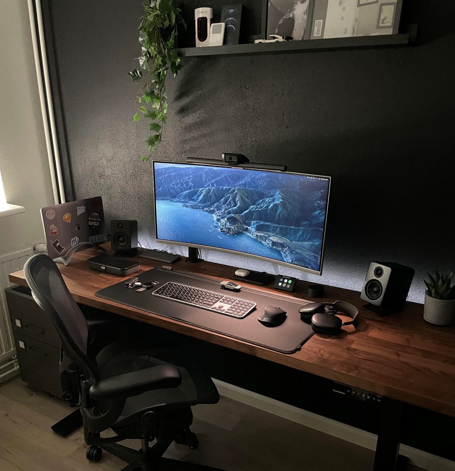 A new house calls for a first-time home office with an ultrawide monitor and plenty of toys.