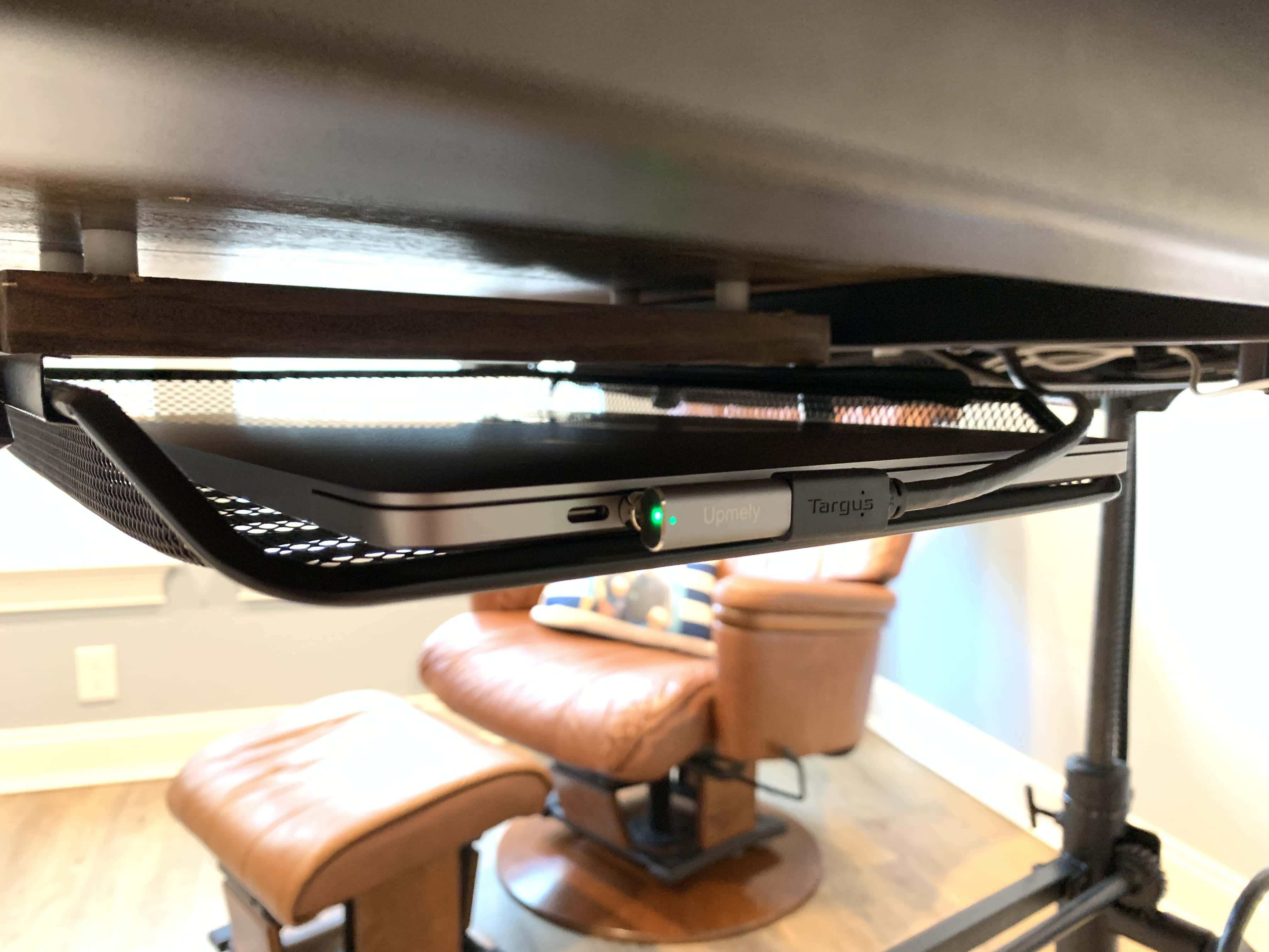 A handy tray mounted under the desk keep the iPad Pro out of the way. 
