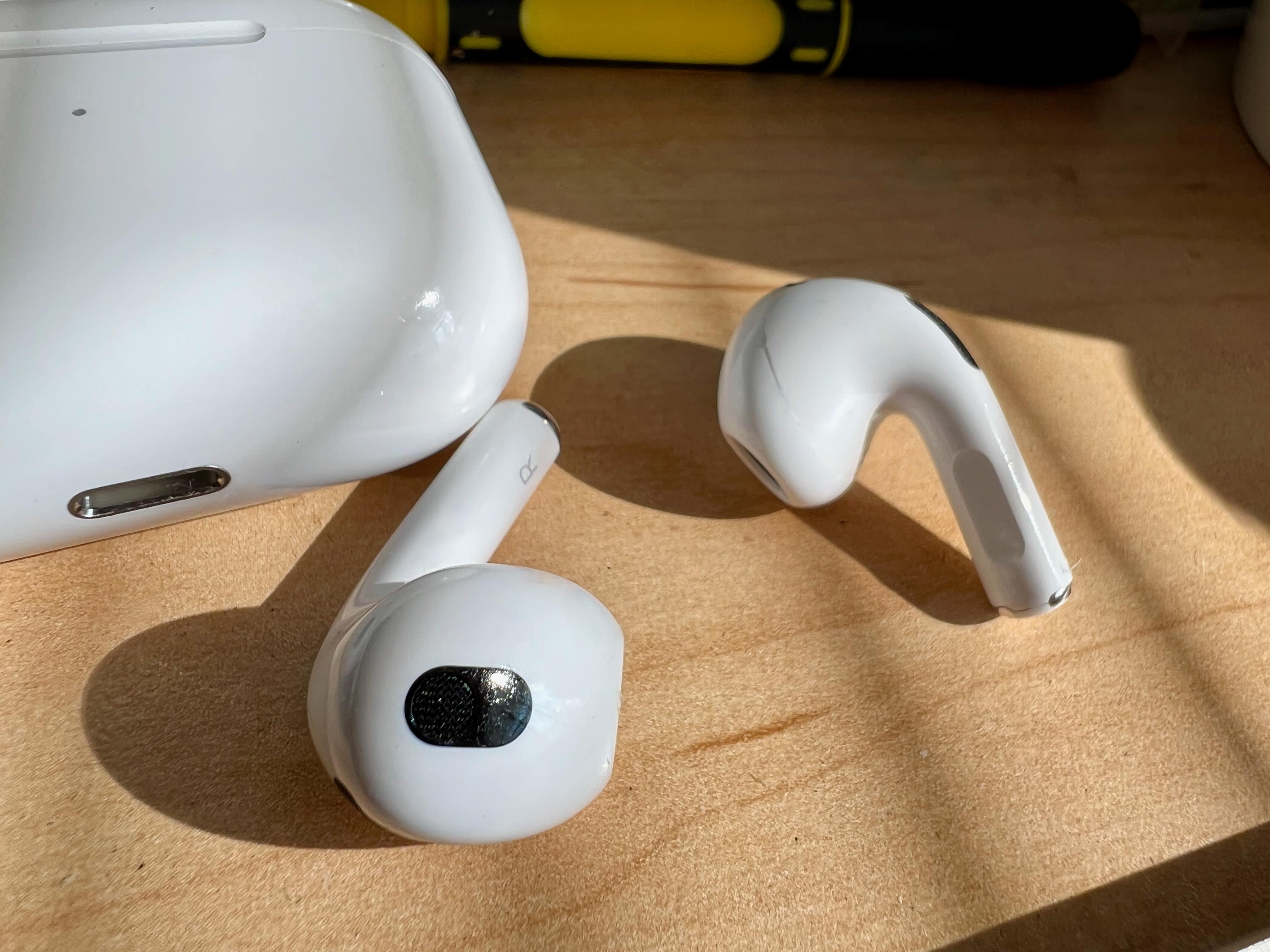AirPods 3 next to case