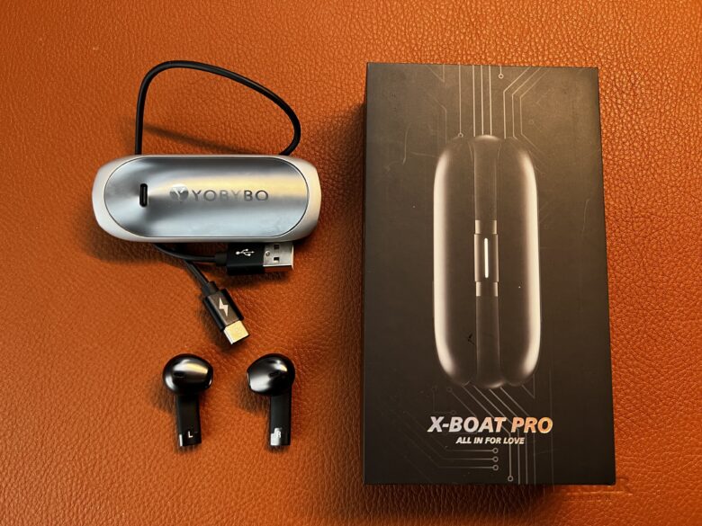 The Yobybo X-Boat Pro earbuds come with a USB cable and a sleek "open" charging case.