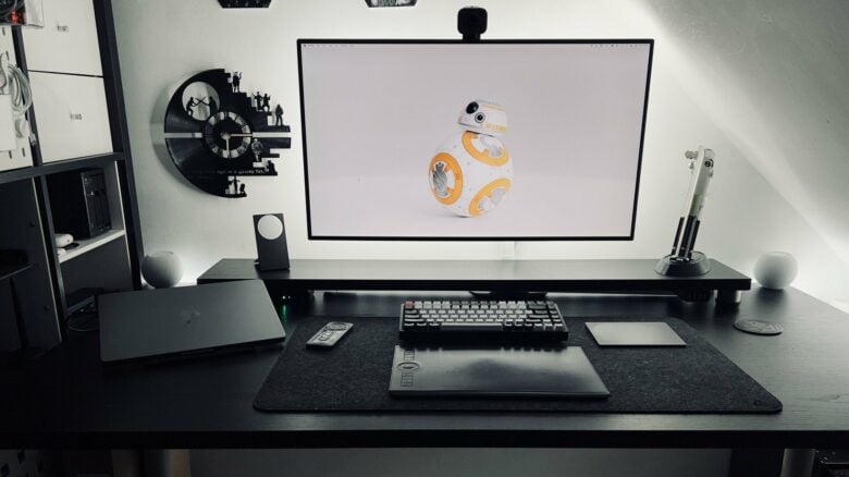 That display is not wall mounted. And it's not levitating, either. It just looks like it is.