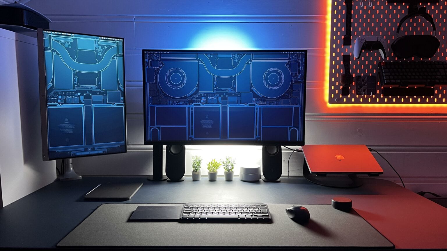 This striking computer setup features very cool wallpaper on the screens.