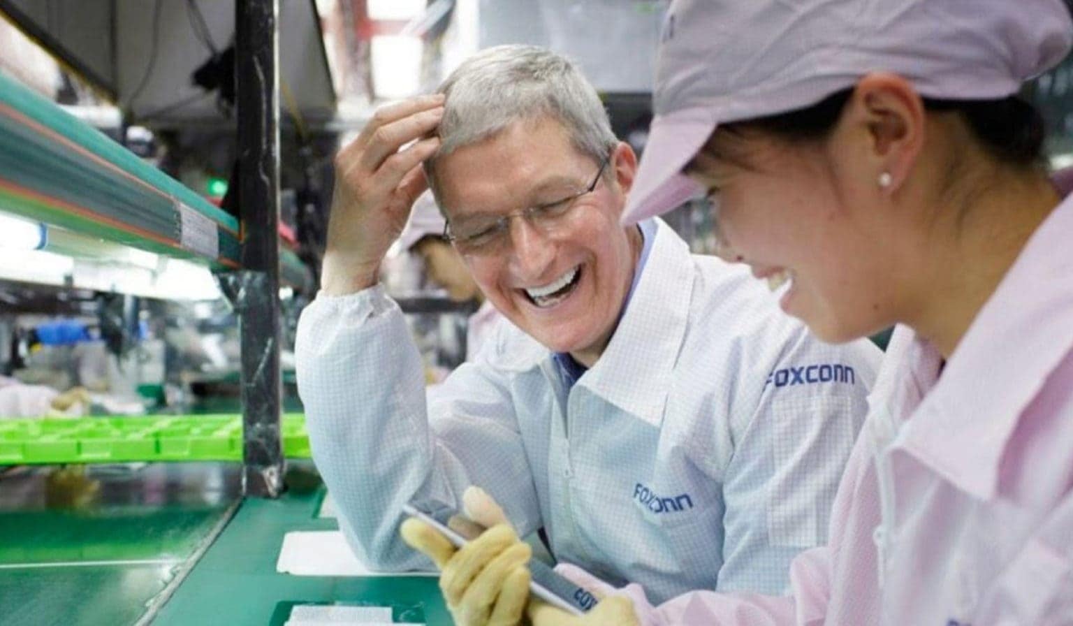 Apple CEO Tim Cook meets with a Foxconn worker on a previous occasion.