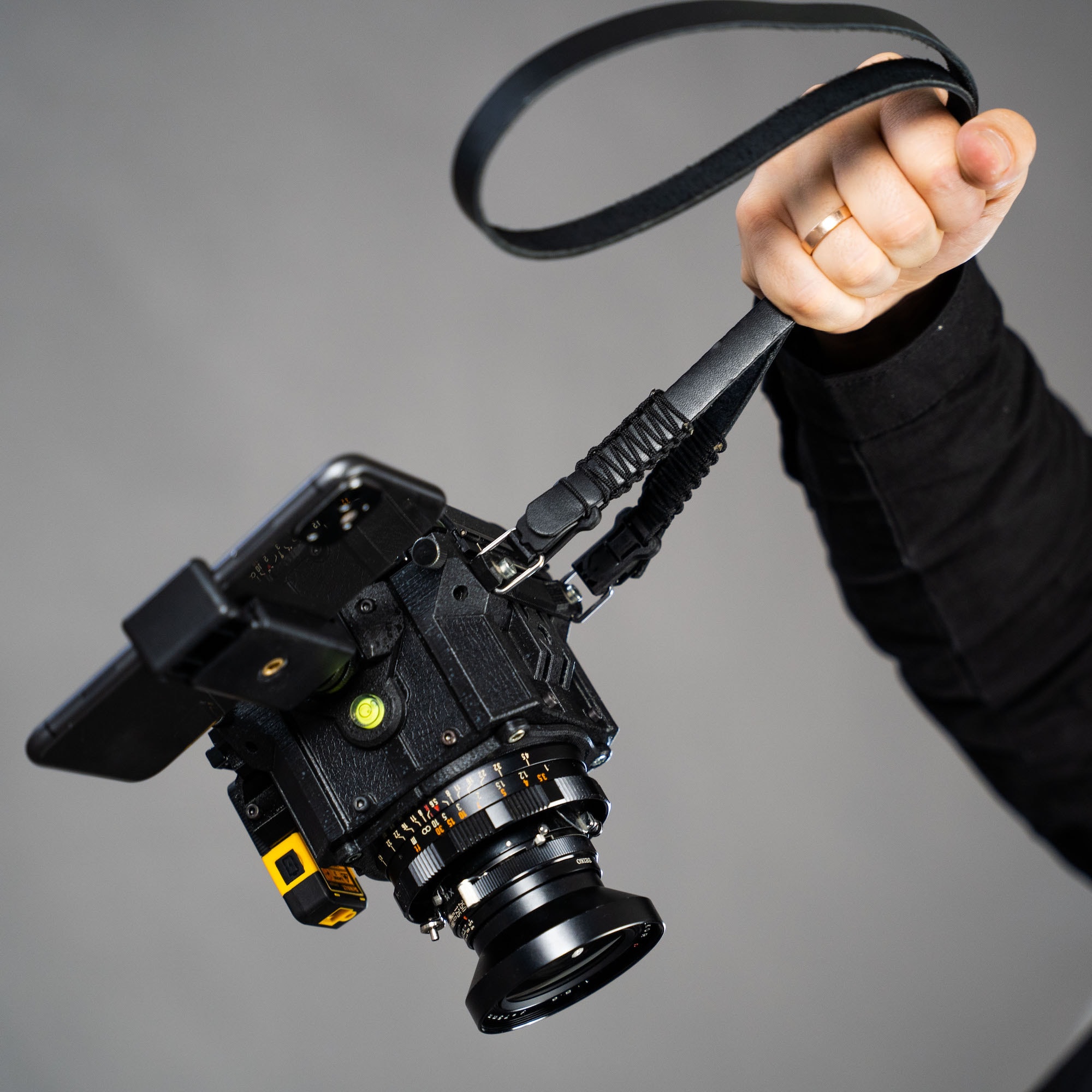 Safely Carry Your Cameras With This Magnetic Locking Strap Cult Of Mac