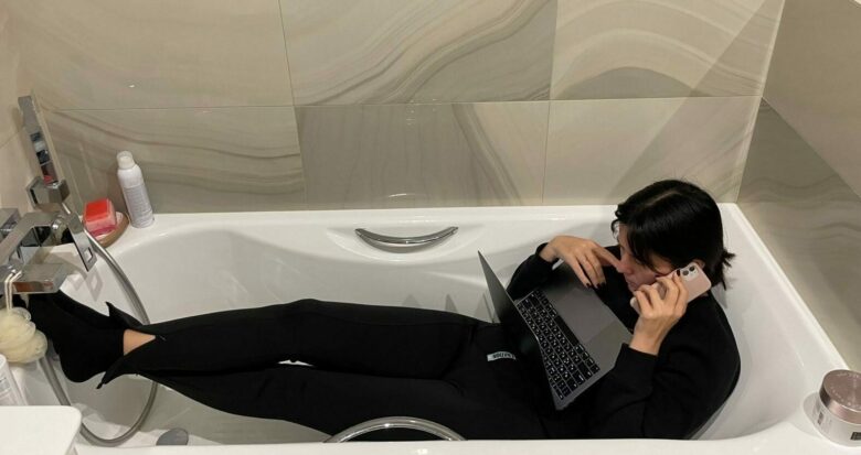 MacPaw's Julia Petryk works in her bathtub, the safest place in her Kyiv apartment as Russian bombs and missiles fall.