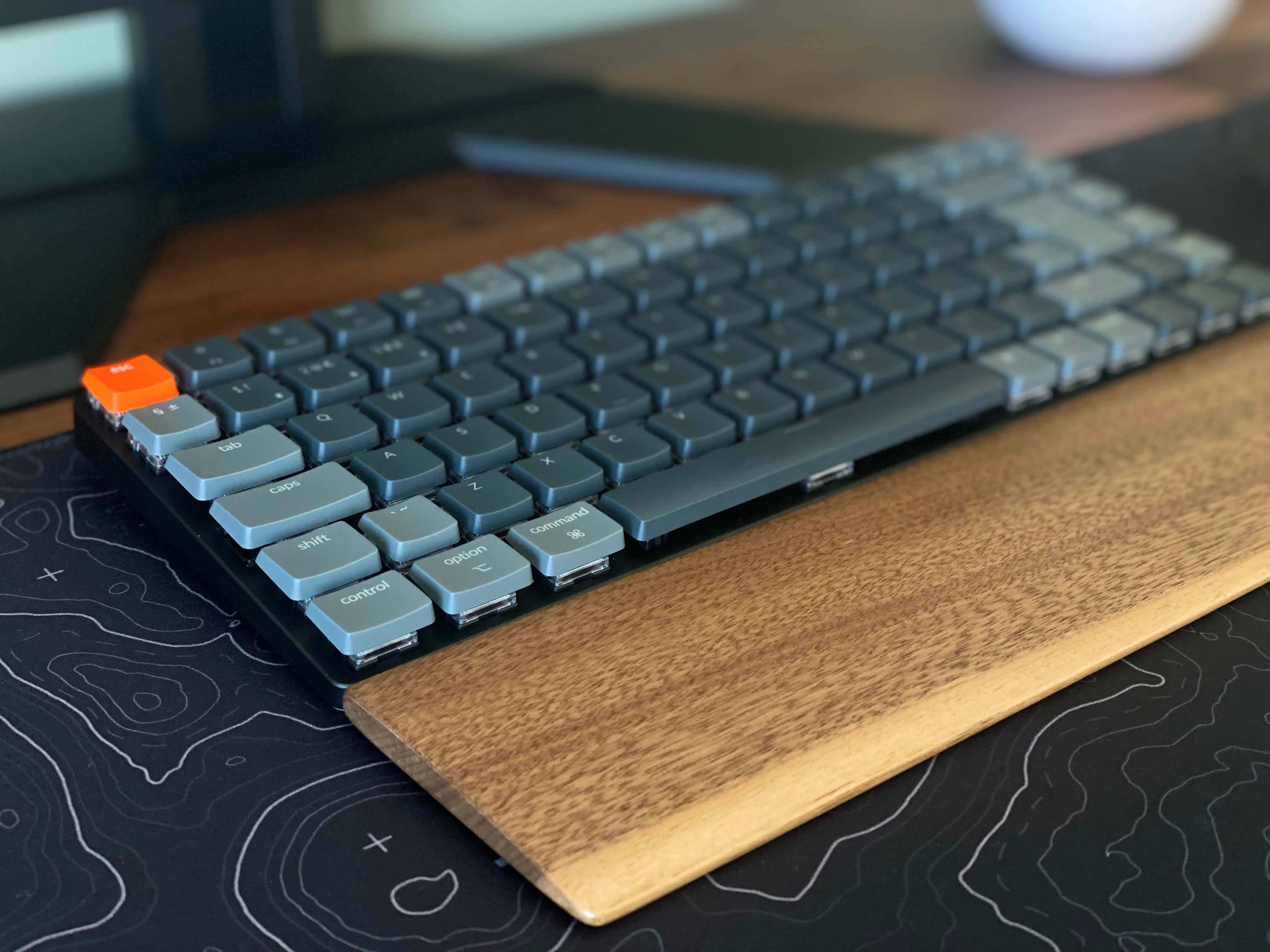 We like the wooden wrist rest with that Keychron K3 mechanical keyboard. 