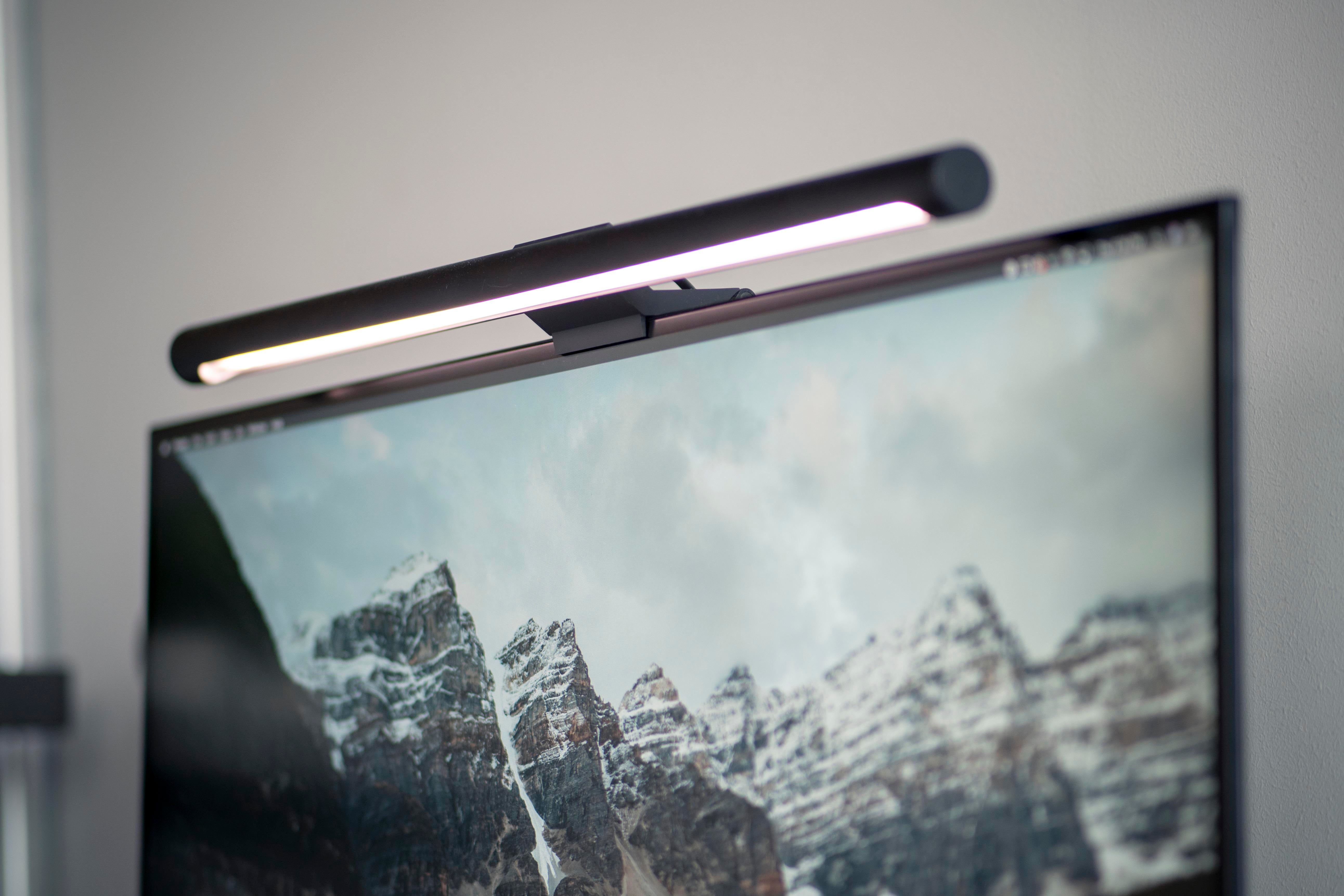 The Xiaomi light bar perched atop the monitor lights up the desk and eases eye strain.