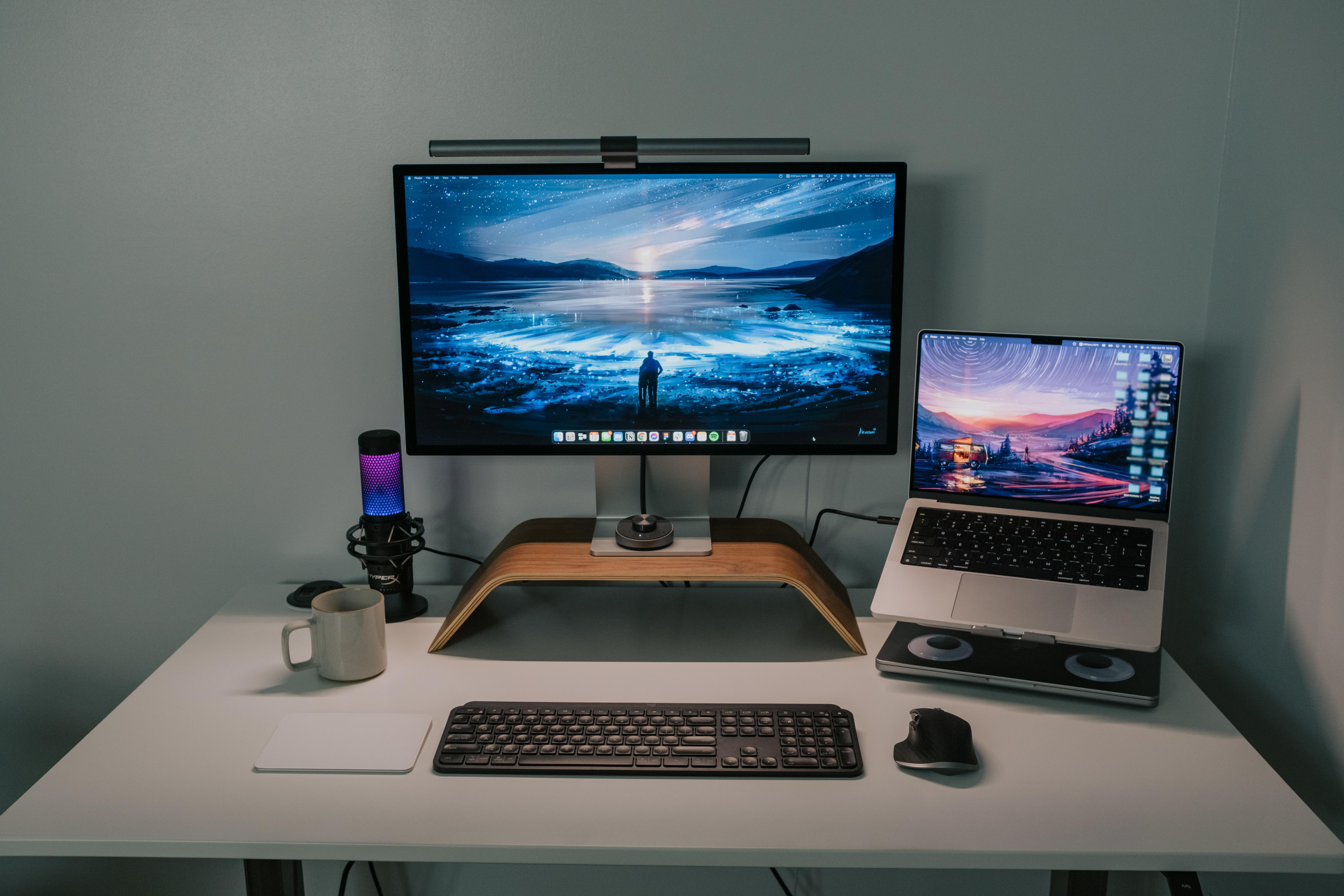 The flashy RBG microphone sits to the left of the Studio Display.