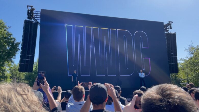 Apple CEO Tim Cook and SVP of Software Engineering Craig Federighi take the stage to greet attendees before the prerecorded WWDC22 keynote plays.