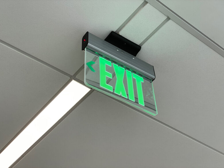 The Exit signs have a neat optical illusion. At a glance, they appear to be transparent glass. But when you look at the opposite side, “Exit” isn’t reversed -- it reads normally. They’re not actually transparent, though. They’re mirrored. They look transparent because the ceiling lines are so consistent.