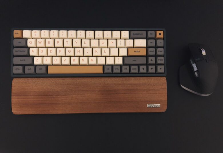 The Logitech K14 wireless mechanical keyboard with its matching wooden palm wrest.