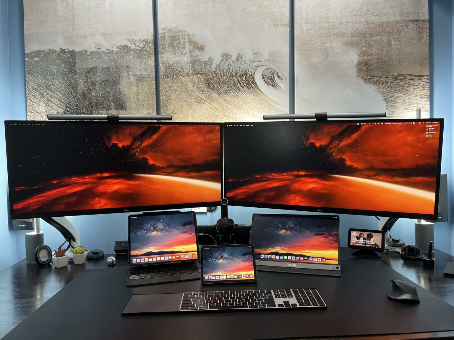 The M1 Mac mini isn't pictured, but you can't miss the dual 34-inch displays, two iPads and an Echo Show 5.