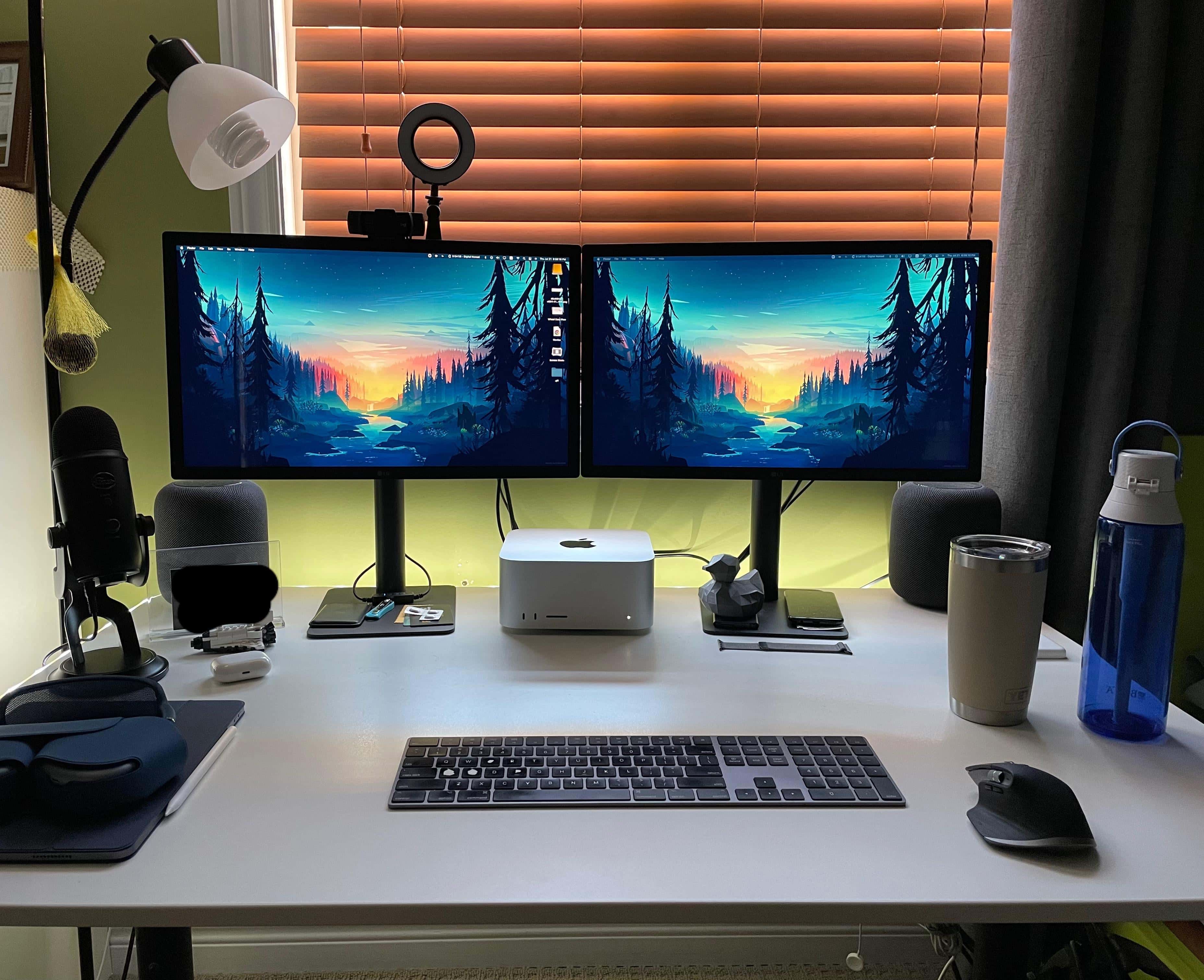 In the "before" pic, you can see two monitors on stock stands filling the back of the desk. The Magic Keyboard was replaced by a mechanical board, too. 