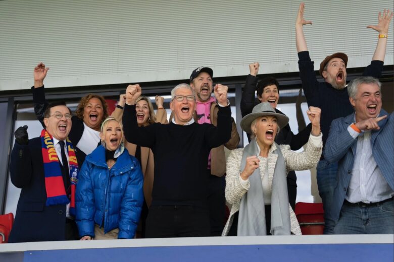 It really looks like Tim Cook and the "Ted Lasso" cast are cheering on the fictional AFC Richmond soccer club.