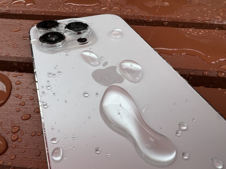iPhone 14 Pro covered in drops of water