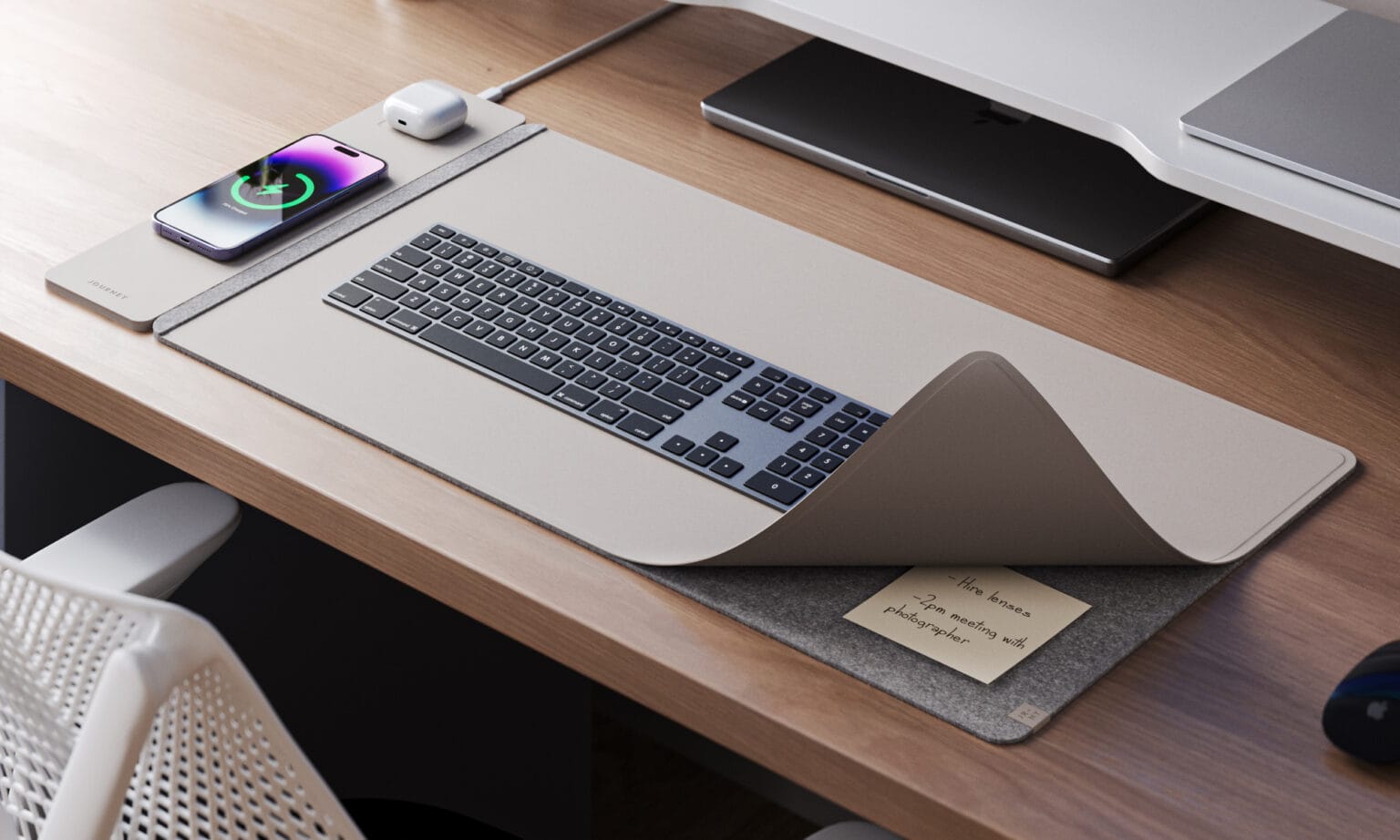 The desk mat's charging panel is a convenient place to top off your smartphone and earbuds charging case.