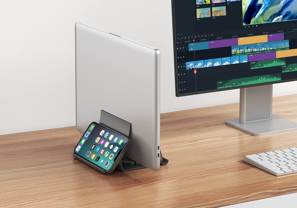 Momax Vertical Laptop Stand Holder is a good place for your MacBook and your iPhone or iPad.
