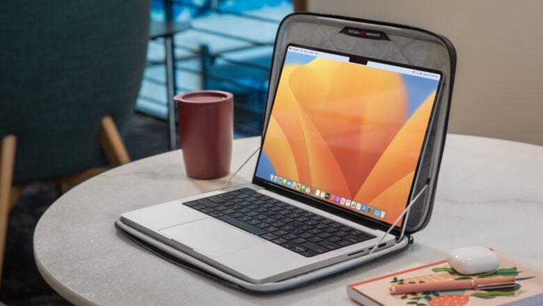 You can use your MacBook without needing to remove the Twelve South SuitCase.