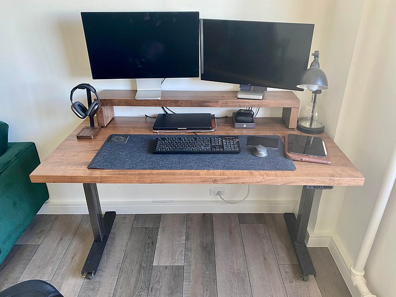 Both the standing desk and monitor shelf sport 3-inch-thick maple.