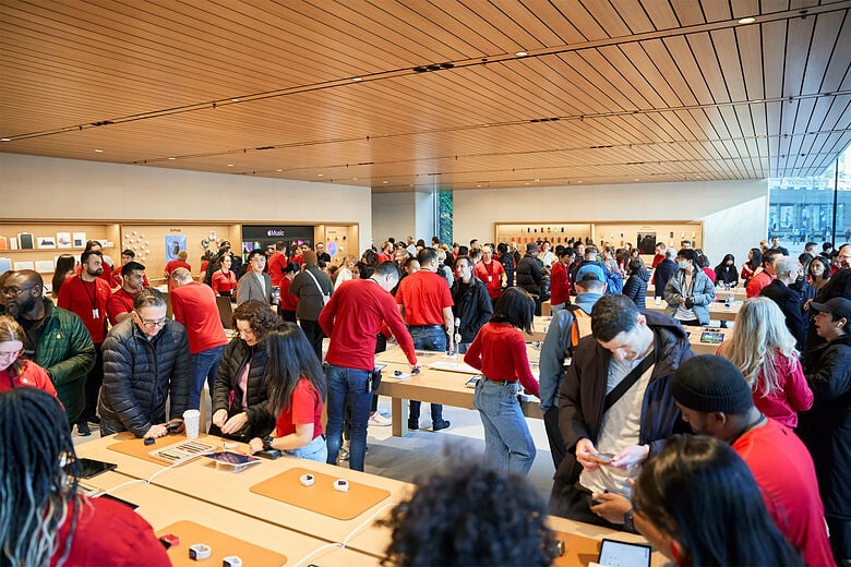 Customers and Apple Specialists teemed in the huge new store. 
