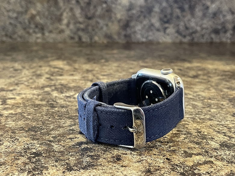 Silver aluminum Apple Watch Series 7 with the blue Durham Nyloon band. A few loose threads after a couple weeks of wear.