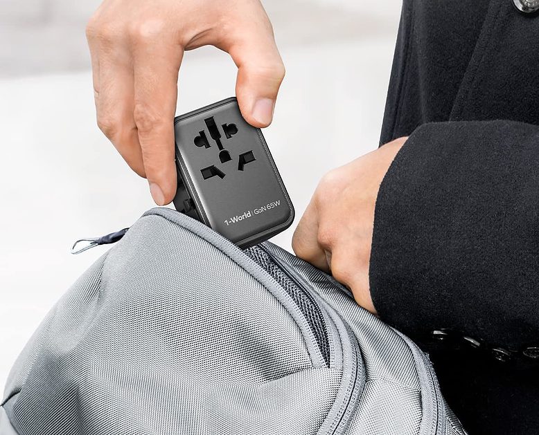 This universal travel adapter fits easily in your travel bag.