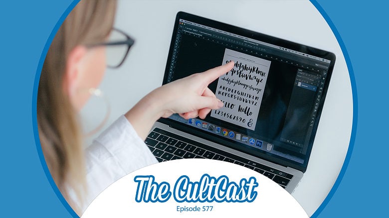 A woman points to her MacBook screen.