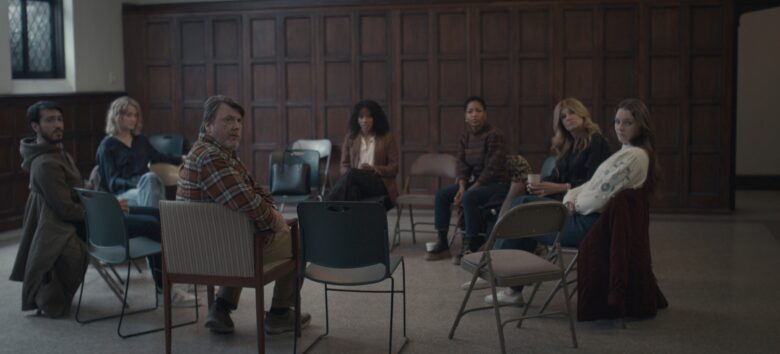 A therapy circle for survivors in a scene from Apple TV+ drama "Dear Edward."
