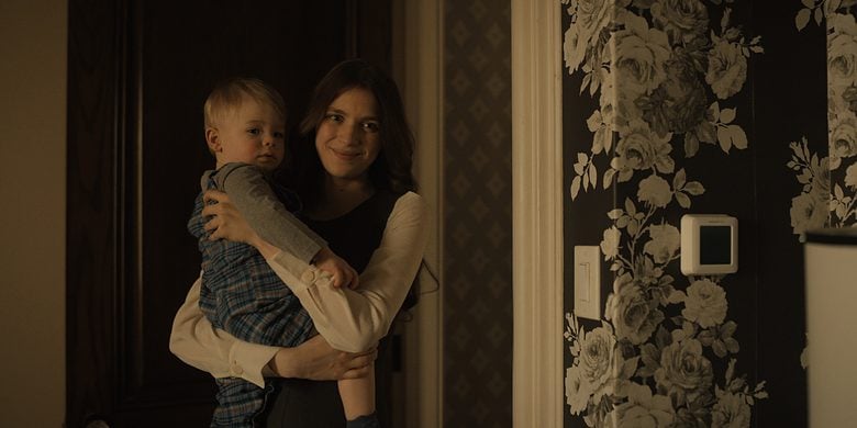 Leanne (played by Nell Tiger Free) holds a baby in a scene from Servant season four on Apple TV.