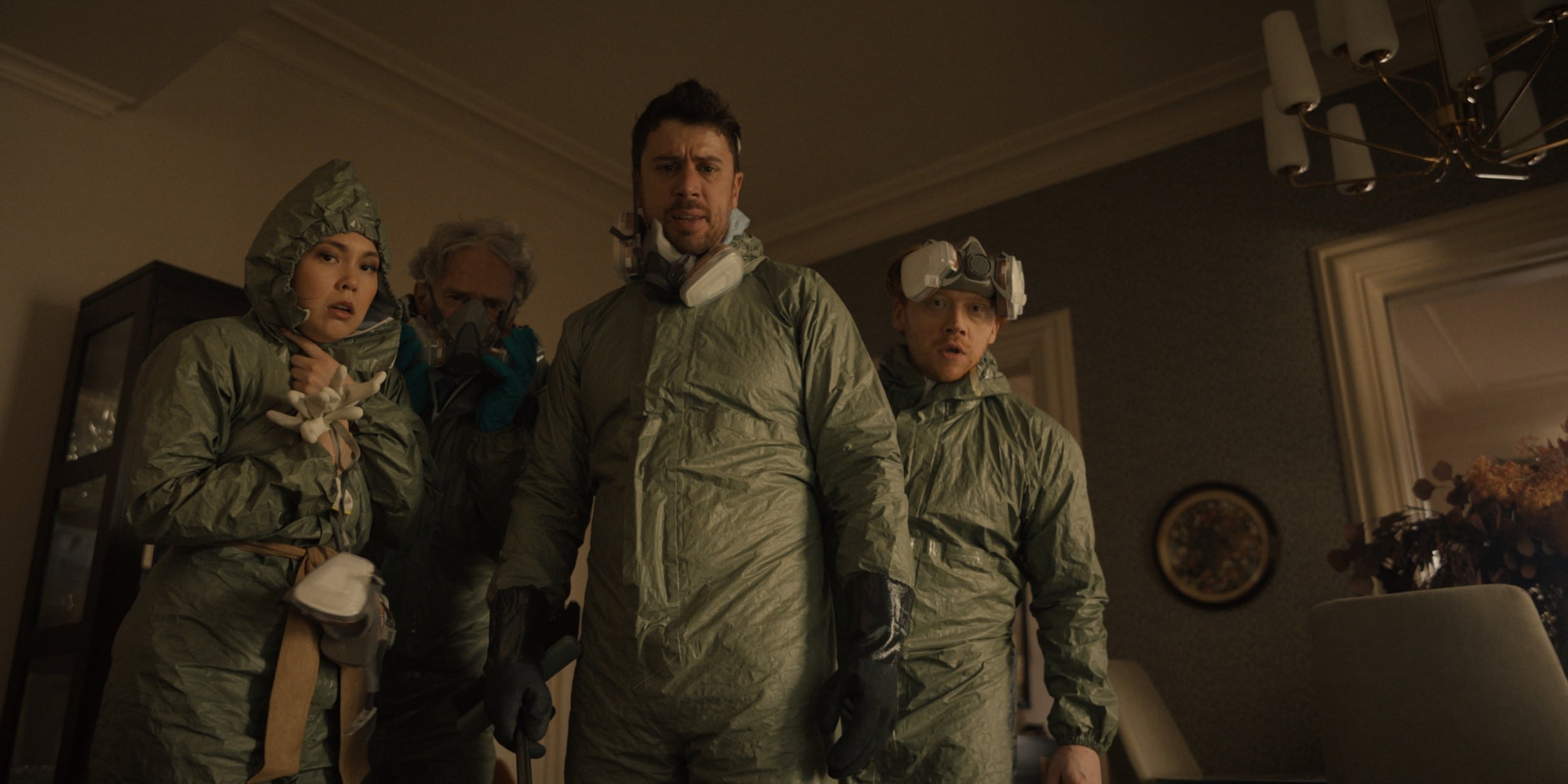 Servant cast members in hazmat suits and gas masks.