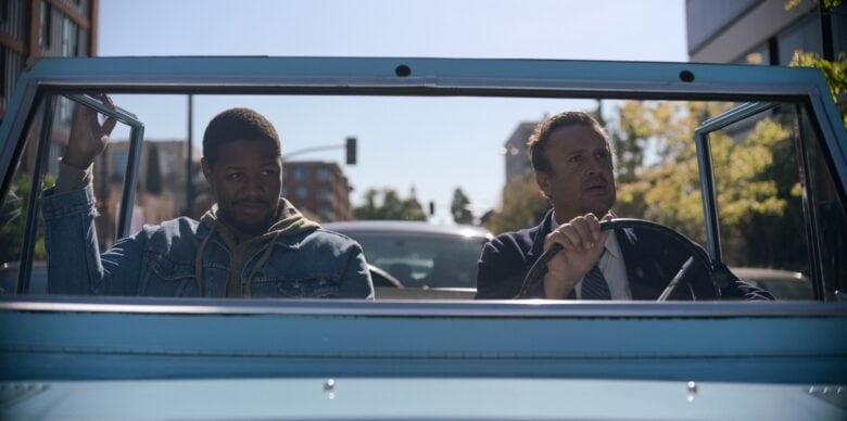 Luke Tennie and James (Jason Segel) drive in a convertible in a scene from new Apple TV+ comedy "Shrinking."