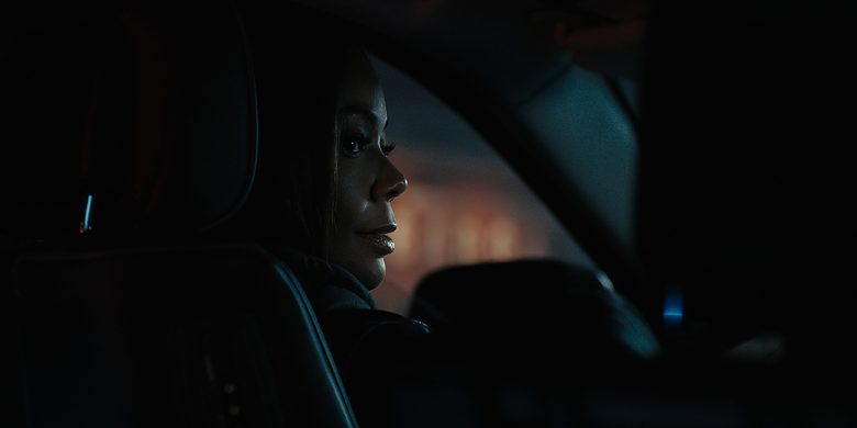 Can we trust Eva (played by Gabrielle Union)? The actress is shown in a still from the "Truth Be Told" season three opener.