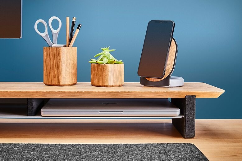 The cork legs won't scratch your desk and the aluminum shelf has a back to keep stuff from falling off. 