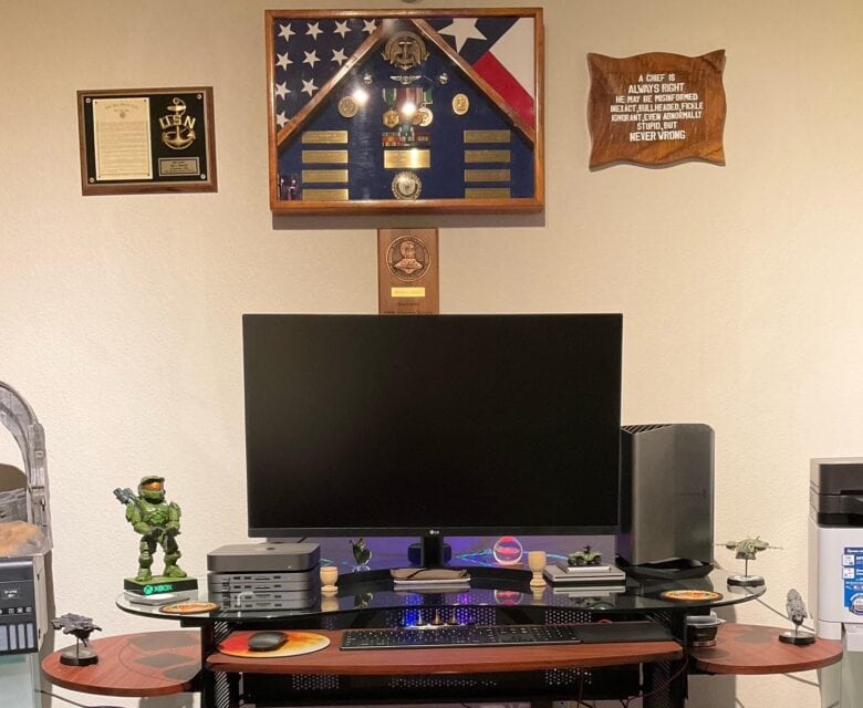 This shot shows Navy memorabilia -- a Master Chief model at lower left, plus the plaques above the display.