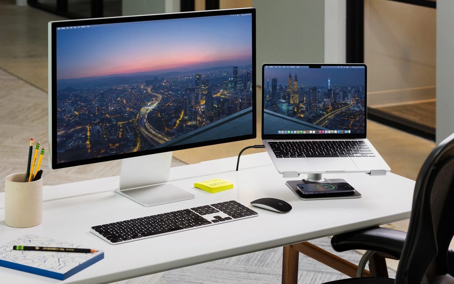 You can adjust the stand's height to bring your MacBook's screen to eye level and align it with your main external monitor.
