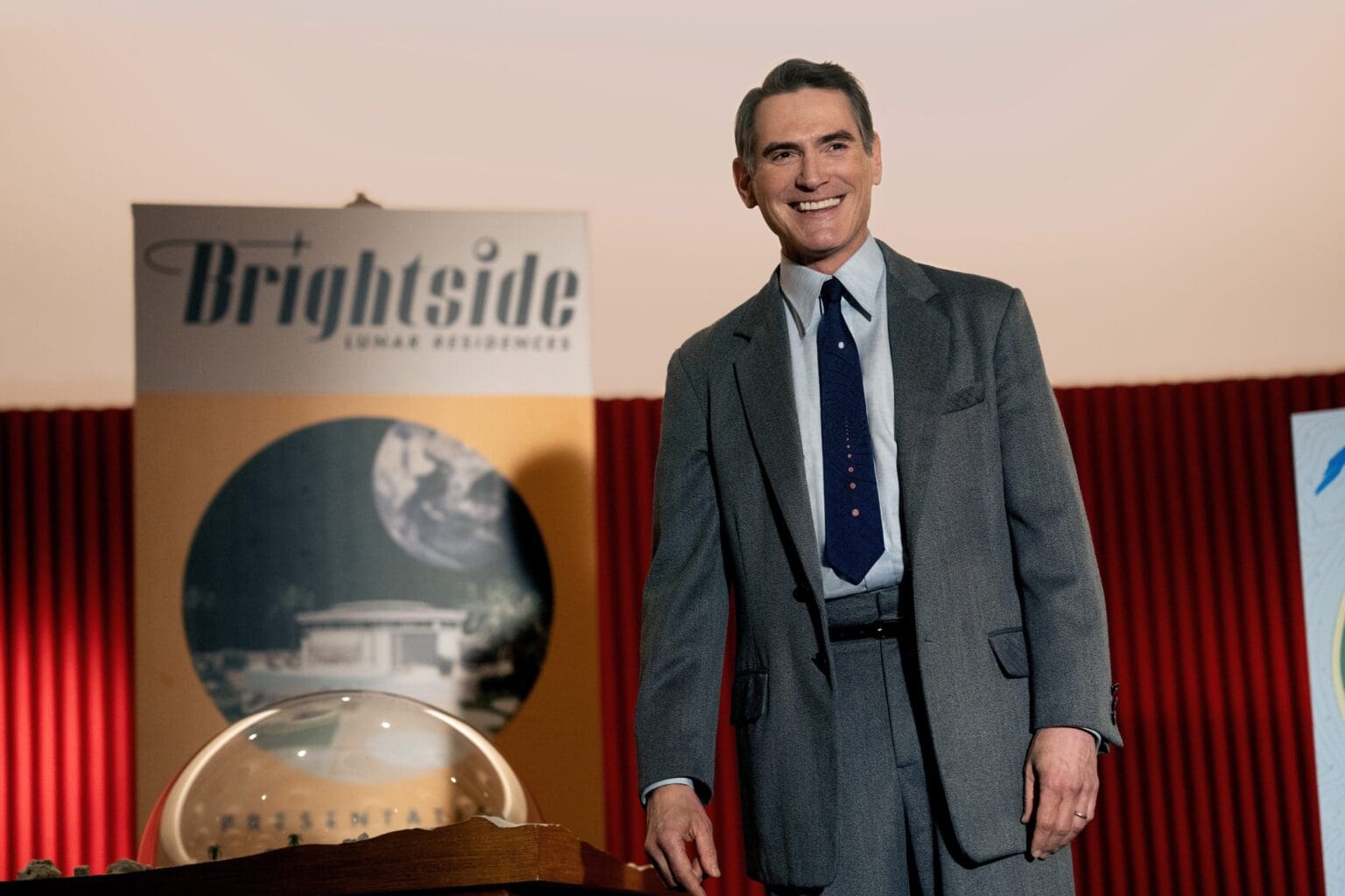 Billy Crudup plays Jack Billings, who's shown giving a sales presentation for lunar timeshare in a scene from Apple TV+ show 
