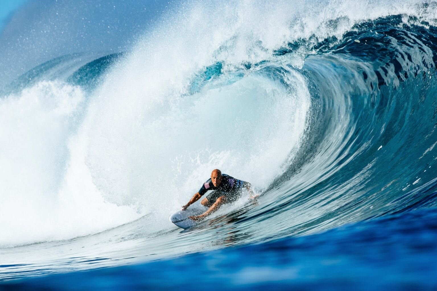 Surfer Kelly Slater catches a wave in 