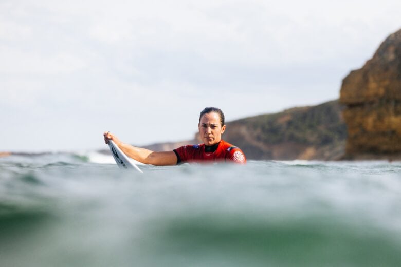 Surfer Tyler Wright bobs in the ocean in a scene from Apple TV+ surfing docuseries "Make or Break."