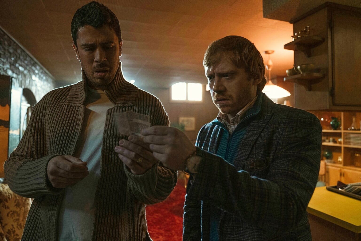 Toby Kebbell and Rupert Grint looks for clues in 